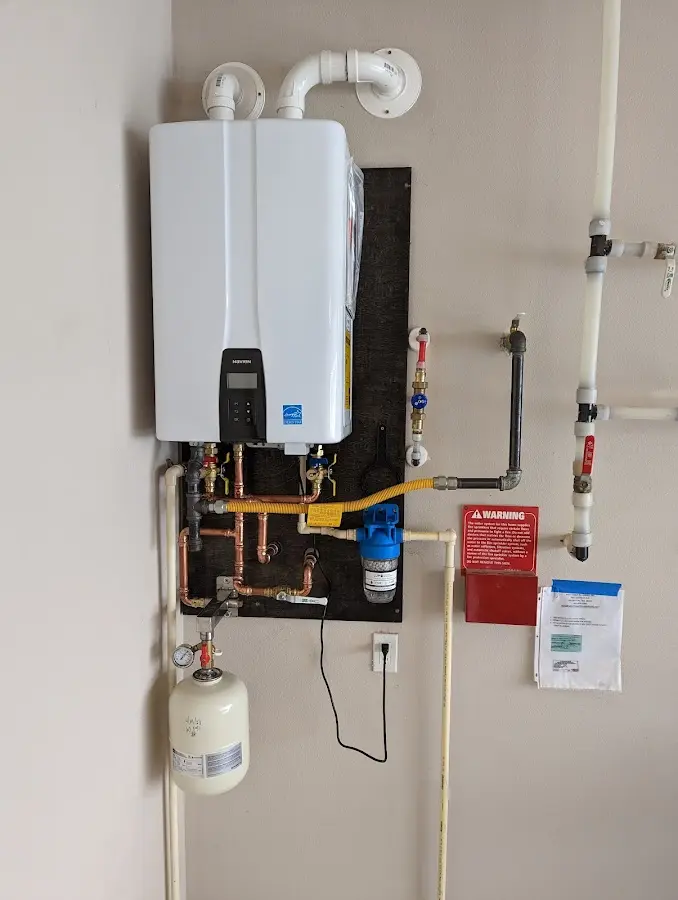 Professional plumber installing copper piping in a Casas Adobes home